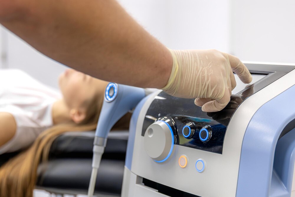 Physiotherapist performs ultrasound therapy on female patient knee joint rehabilitation