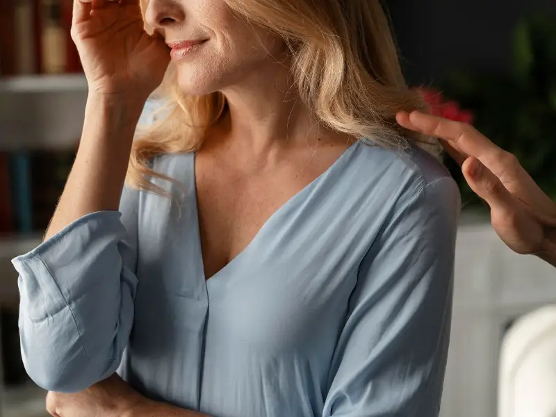 Portrait of woman being comforted in therapy office