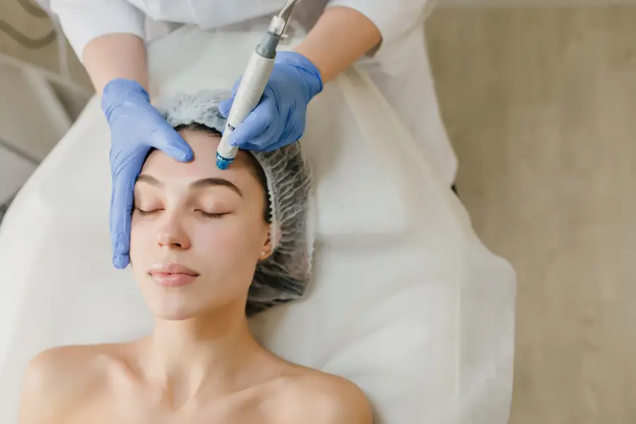 View from above of beautiful woman enjoying cosmetology procedures, rejuvenation in beauty salon. Dermatology, doctor at work, healthcare, therapy, botox.